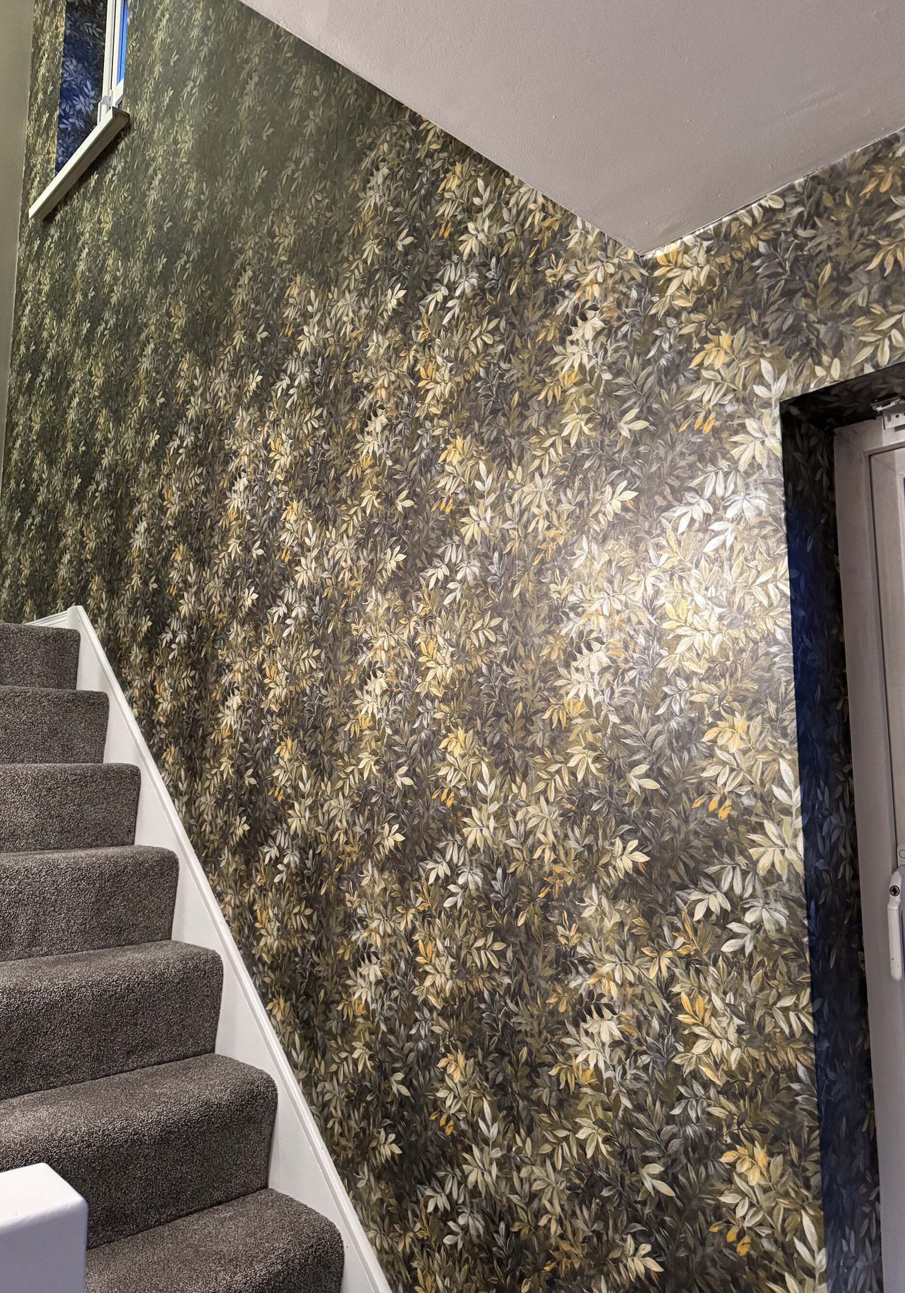 Flowerily wallpaper on stairs